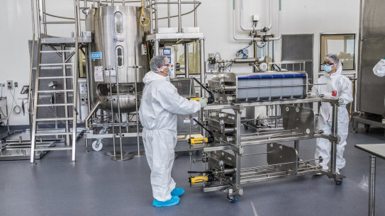 Scientists working in CSL’s production facility for the AstraZeneca vaccine on Thursday.