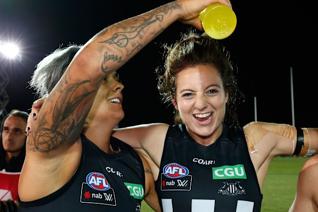 Moana Hope of the Magpies (left) pours Gatorade on Stephanie Chiocci after a win in 2017.
