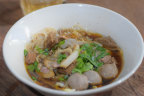 Kuy teav, the clear, pork- and dried-shrimp-based broth and its various toppings.