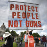 A protester stands with other gun-control advocates during a rally at the state Capitol in Olympia, Washington over the weekend. 
