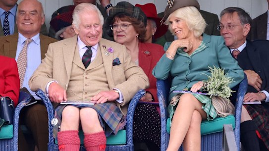 King Charles III and Queen Camilla laughing in Braemar, Scotland, at the weekend.