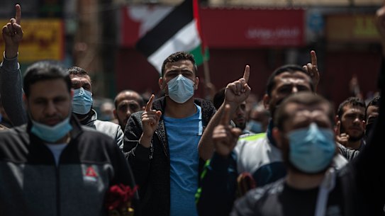 Palestinian Hamas supporters chant anti Israel slogans during a protest in solidarity with Muslim worshippers in Jerusalem.