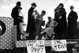 University of Sydney students re-enact the dramatic moment when Evdokia Petrov was dragged onto a Moscow-bound plane by Soviet officials.