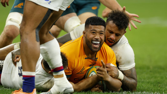 Folau Fainga’a dives over for the Wallabies.
