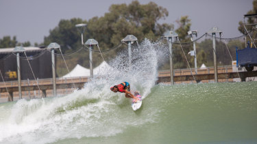 A surfer rides the wave during the first day of a world championship tour at California's Surf Ranch.