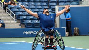 Dylan Alcott celebrates winning championship point against Niels Vink of the Netherlands in their US Open wheelchair quad singles final match. 