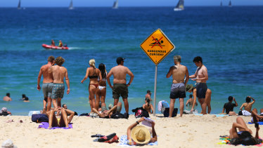 Beachgoers enjoy the hot weather at Bondi Beach.