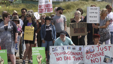 Protesters on a beach near Turnberry golf club, Scotland, on Saturday, July 14.