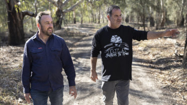 Environmental Justice Australia lawyer Bruce Lindsay and Brendan Kennedy walk near the lagoon.