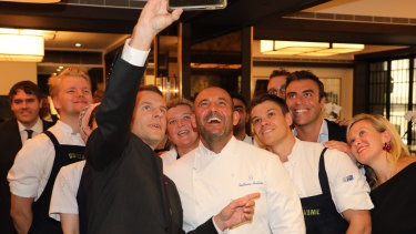 French President Emmanuel Macron taking a selfie with chef Guillaume Brahimi in May.