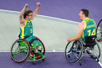 Lachlin Dalton and Jake Kavanagh celebrate after defeating Canada in the men's wheelchair 3x3 basketball final.