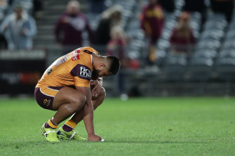 Payne Haas sinks to his knees after the Broncos' sixth straight loss on Saturday night.