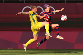 Megan Rapinoe and Clare Polkinghorne clash at the Tokyo Olympics in August.