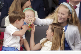 Prince Louis, Princess Charlotte and Savannah Phillips eat sweets, during the Platinum Jubilee Pageant held outside Buckingham Palace, in London.