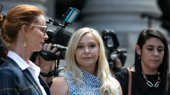 Virginia Giuffre (centre) leaves a New York Federal Court in 2019.