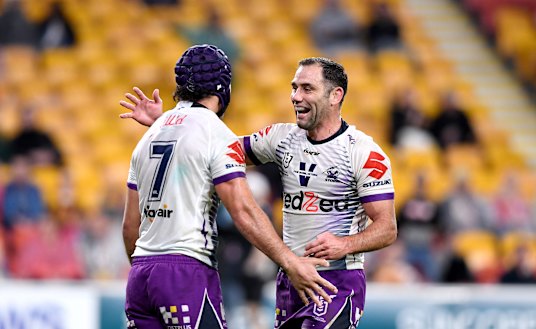 Jahrome Hughes with Storm captain Cameron Smith.