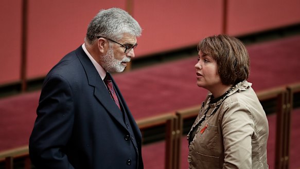 Senators Kim Carr and Kimberley Kitching in discussion during debate in March 2018.