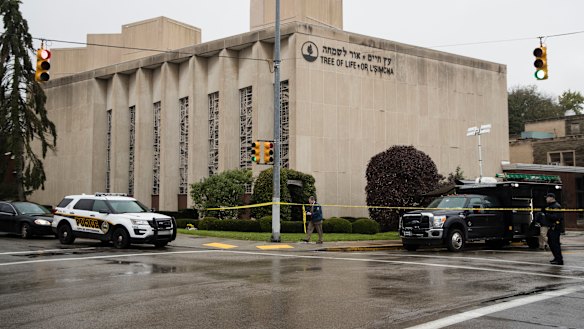 Police stand guard outside the Tree of Life Synagogue in Pittsburgh where a shooter opened fire.