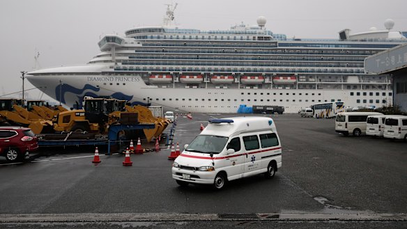 An ambulance leaves the port where the quarantined Diamond Princess cruise ship is docked. 