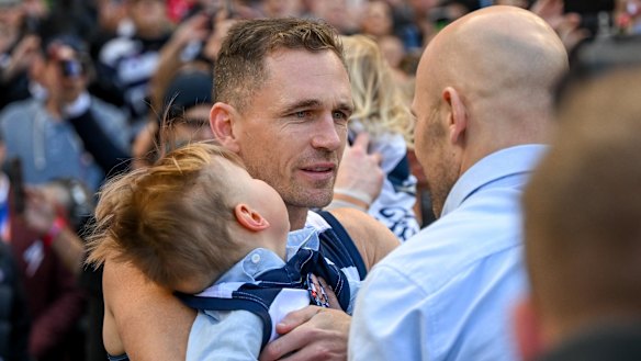 Joel Selwood takes great mate Gary Ablett jnr’s son Levi out on to the field with him.
