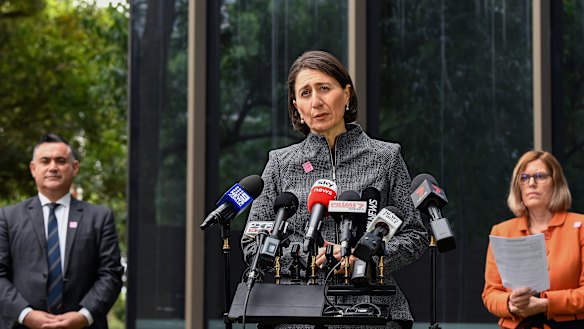 Deputy Premier John Barilaro, Premier Gladys Berejiklian and Chief Health Officer Dr Kerry Chant at a press conference in Sydney on Monday. 