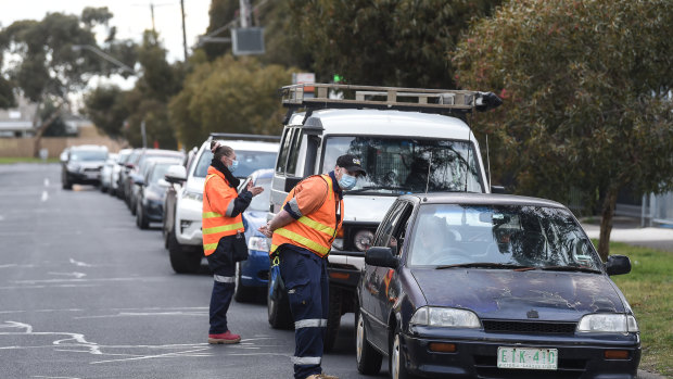 Cars line up at a coronavirus testing site on Tuesday in Fawkner, one of the suburbs included in the lockdown.  
