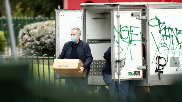 Bill Shorten delivers food to the Flemington towers on July 6.