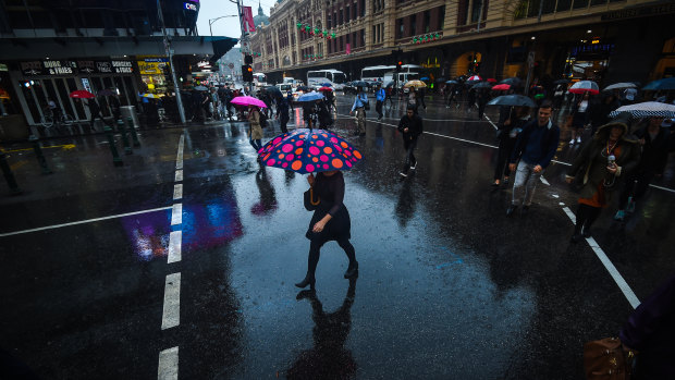 Rain soaks Melbourne. 