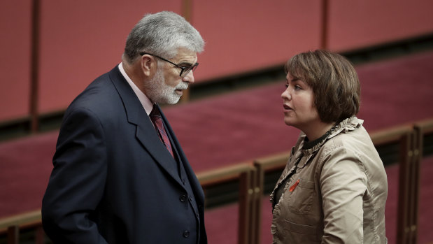 Senators Kim Carr and Kimberley Kitching in discussion during debate in March 2018.