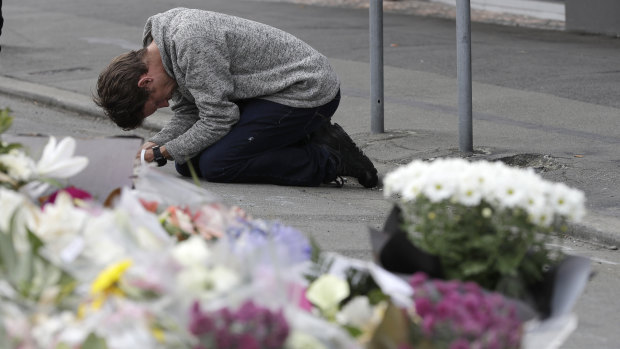 A mourner prays near the Linwood mosque in Christchurch.