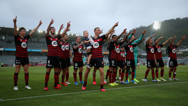Wanderers celebrate with fans at fulltime after their win over the Central Coast Mariners.