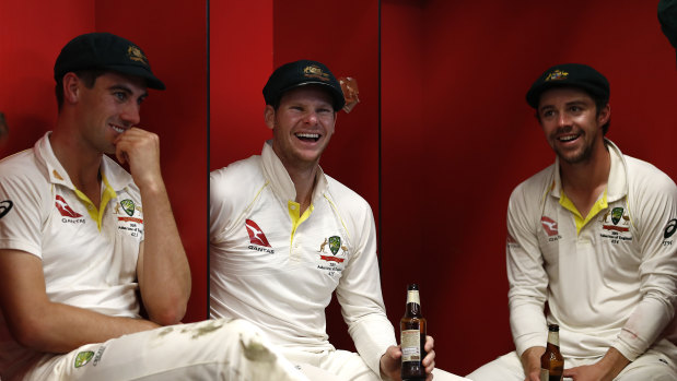 Pat Cummins (left), Steve Smith and Travis Head celebrate Australia's retention of the Ashes in September.