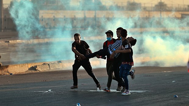 A protester is injured during the demonstration as the number of people killed by police rises to at least 91.