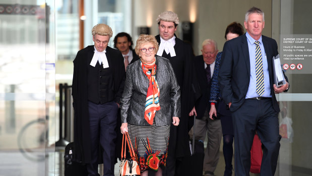 Mary Wagner (centre), her son Denis Wagner (right) and members of the family leave the Supreme Court in Brisbane, Thursday.