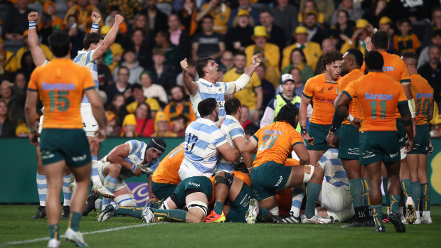 The Pumas celebrate their three-point win over the Wallabies.