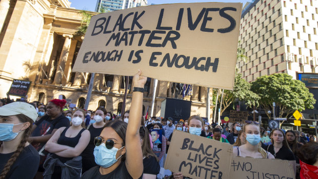 Protesters participate in a Black Lives Matter rally in Brisbane on Saturday.
