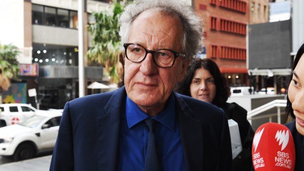 Geoffrey Rush arriving at court on Monday. 