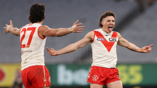 Errol Gulden and the Swans celebrate a goal in the victory over Essendon in round 20, Sydney’s fifth win in a row.