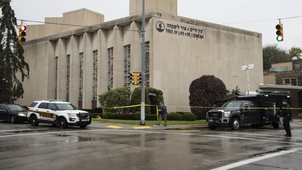 Police stand guard outside the Tree of Life Synagogue in Pittsburgh where a shooter opened fire.