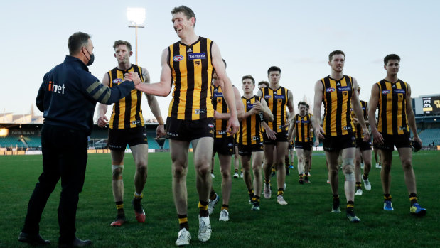 Alastair Clarkson celebrates with skipper Ben McEvoy after the Hawks’ win over the Brisbane Lions at UTAS Stadium.