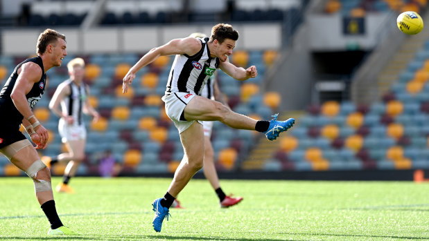 Kicking goals: Josh Thomas boots a major for the Magpies.