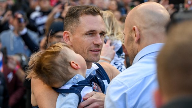 Joel Selwood takes great mate Gary Ablett jnr’s son Levi out on to the field with him.