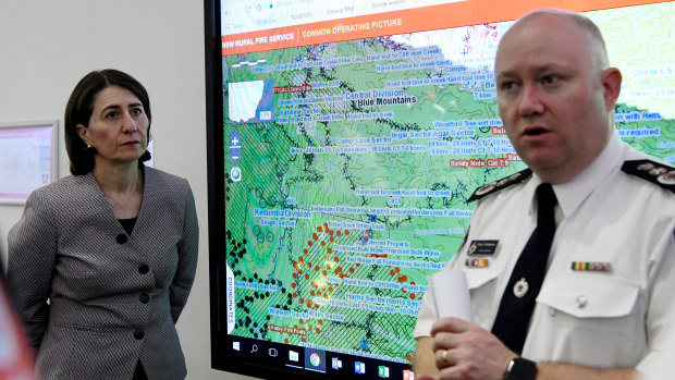 NSW Premier Gladys Berejiklian is briefed by RFS Commissioner Shane Fitzsimmons at the RFS headquarters in Sydney, Monday, January 6, 2020.