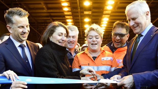 NSW Transport Minister Andrew Constance, left, Premier Gladys Berejiklian, training coordinator Marlee Mirabito and Deputy Prime Minister Michael McCormack cut the ribbon on Friday to officially open the new tunnels.