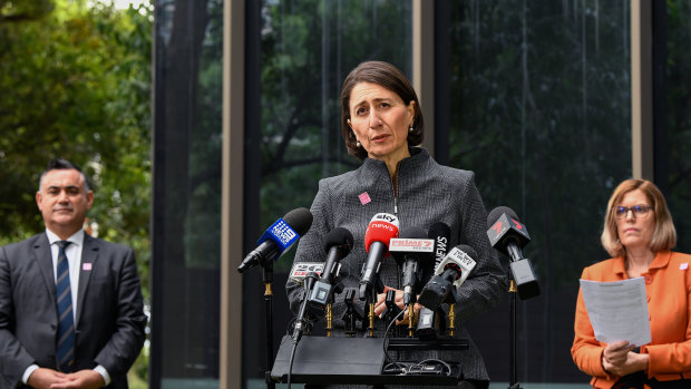 Deputy Premier John Barilaro, Premier Gladys Berejiklian and Chief Health Officer Dr Kerry Chant at a press conference in Sydney on Monday. 