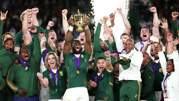 Springboks captain Siya Kolisi hoists the Web Ellis Cup.