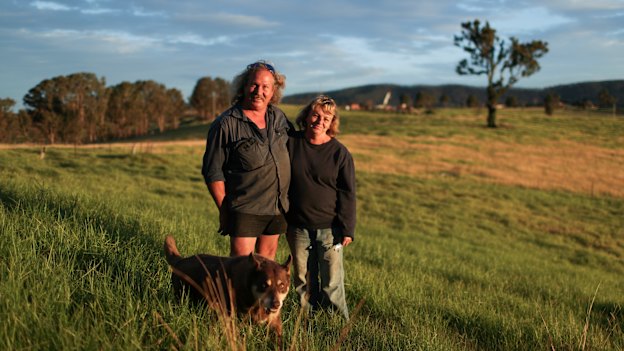 Brad and Gail Rayer, with their dog Wally, estimate they will lose $1 million from the bushfires.