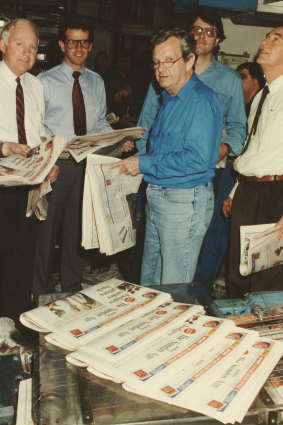 <i>The Sunday Age</i> team take the first-ever edition off the presses on the night of August 19, 1989. Second from left is founding editor Steve Harris, and second from right his deputy, Bruce Guthrie.