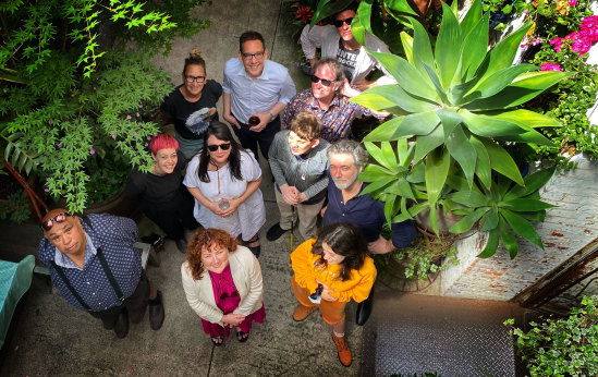 Uncle Kutcha Edwards (left), Bakehouse studios owners Helen Marcou and Quincy McLean, Creative Industries Minister Steve Dimopoulos (centre rear) and Labor candidate for Richmond Lauren O’Dwyer (centre front), and performers and supporters of Bakehouse.