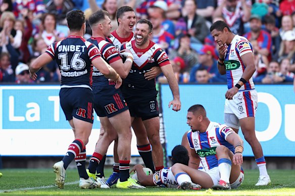 James Tedesco celebrates scoring for the Roosters.